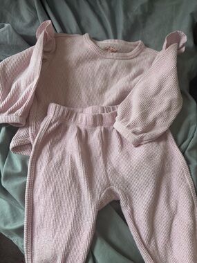 Pink Ribbed Two-Piece Baby Set( see picture) has 2 tiny spots .